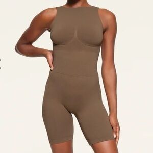 Skims Recycled Nylon Onesie in Oxide